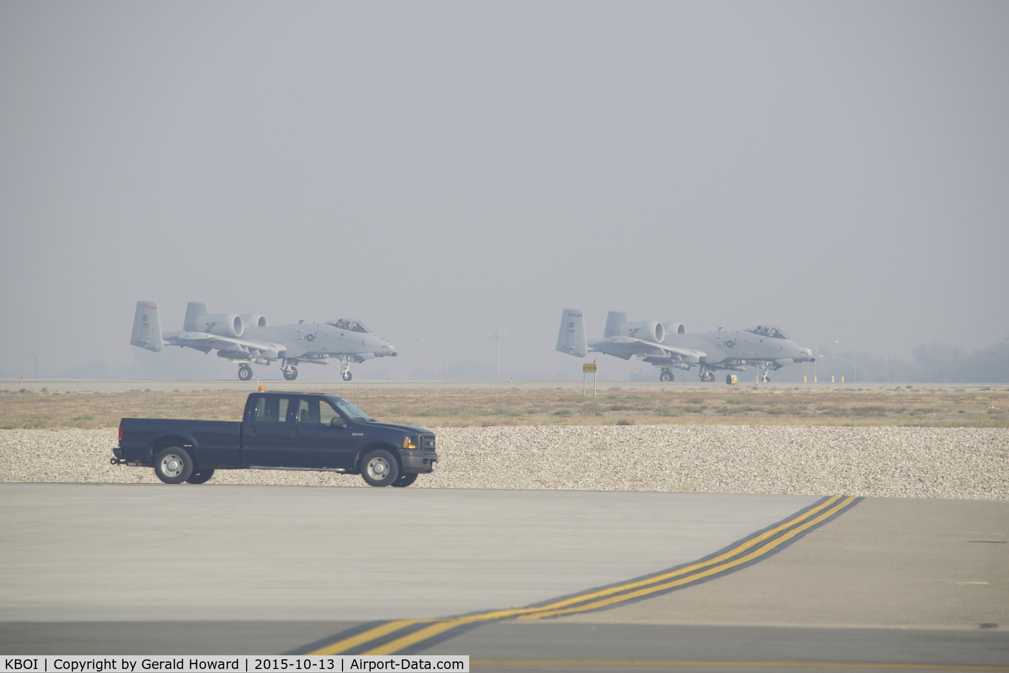 Boise Air Terminal/gowen Fld Airport (BOI) - A-10s lined up on RWY 10R for take off. Smoke filled IFR day.