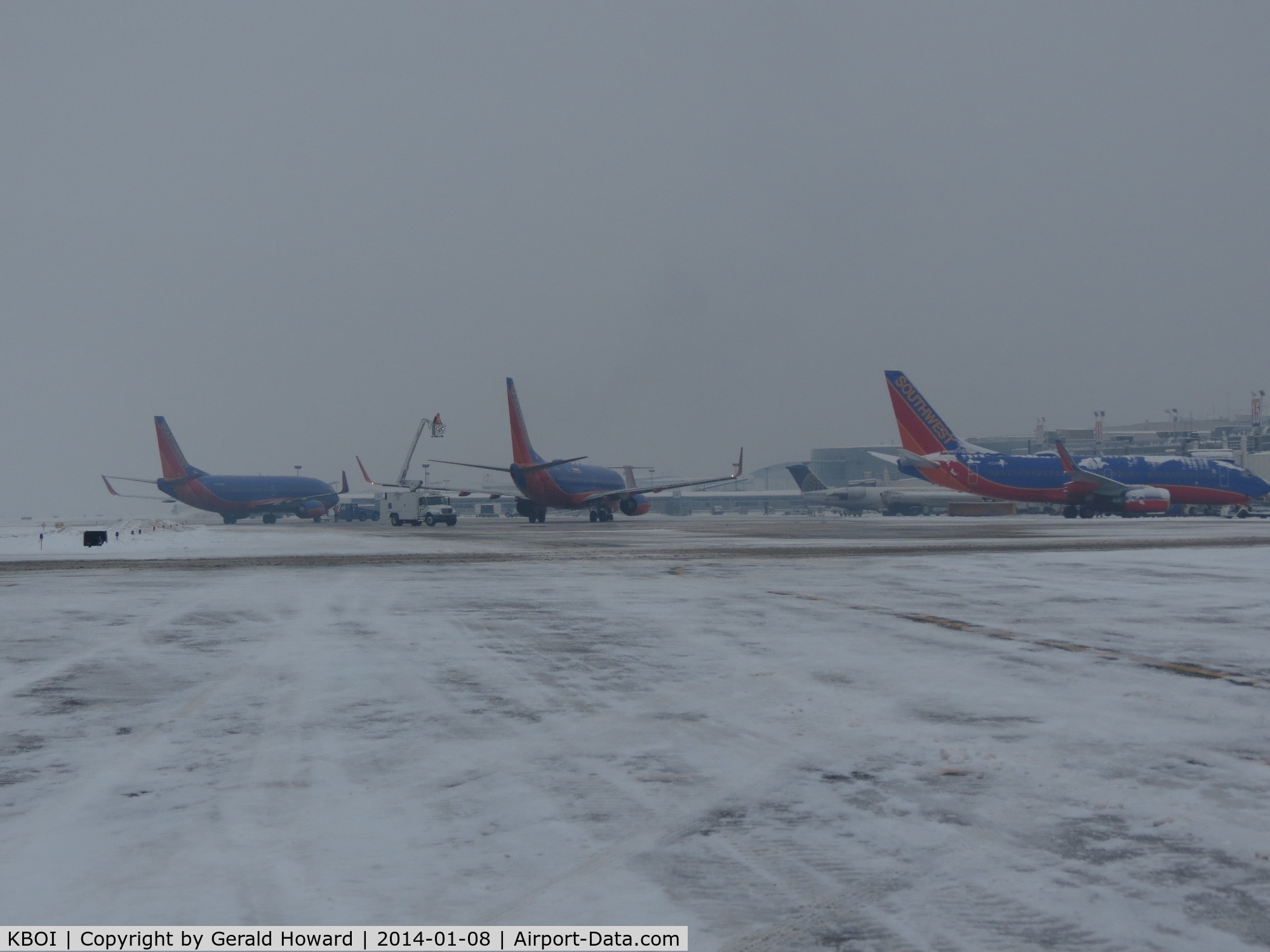 Boise Air Terminal/gowen Fld Airport (BOI) - 3 Southwest jets getting a second de ice before take off.
