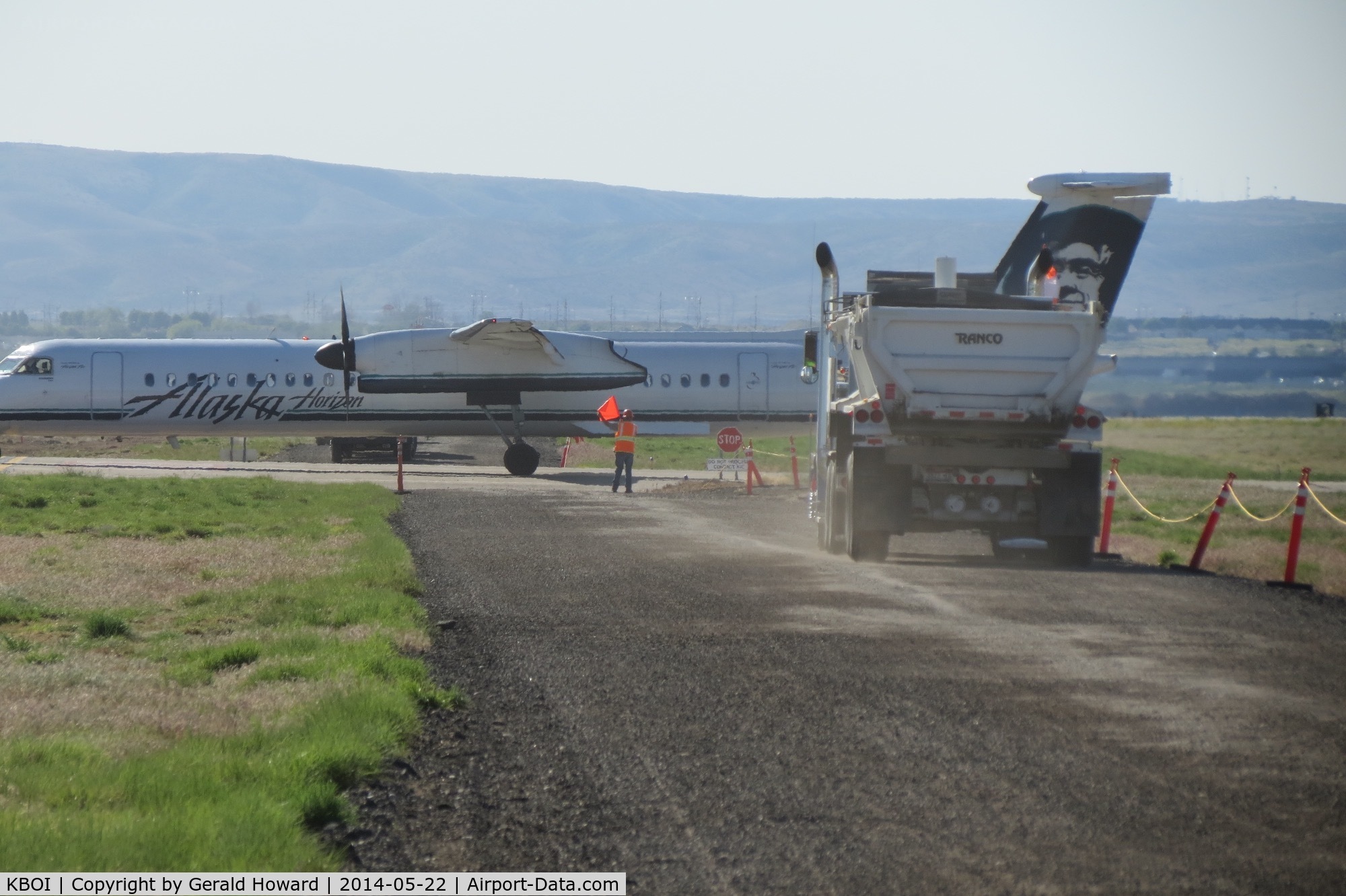 Boise Air Terminal/gowen Fld Airport (BOI) - Flagman at work stopping trucks during construction in May 2014.