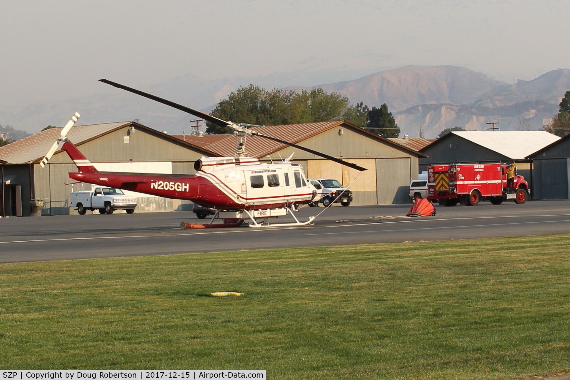 Santa Paula Airport (SZP) - N205GH  1965 Bell UH-1H IROQUOIS, Lycoming T53L-703 Turbo-shaft, Restricted class. at SZP THOMAS Fire Base. NOTE Smoky Sky.