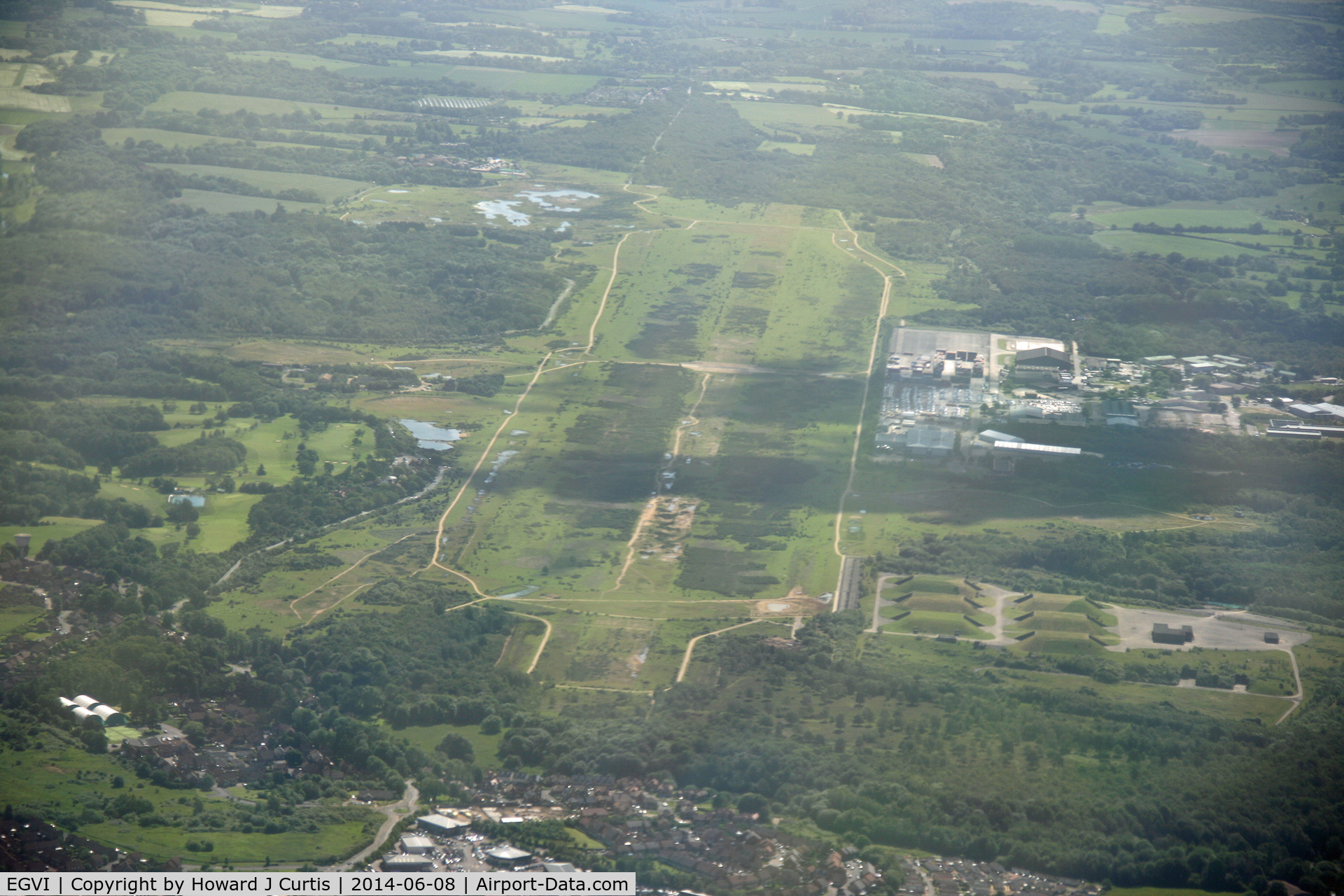 EGVI Airport - The former RAF and USAF base at Greenham Common, as seen from Bulldog G-GRRR. The main runway can just be picked out to the right of centre. Now being returned to nature, some hardened shelters still remain (lower right).