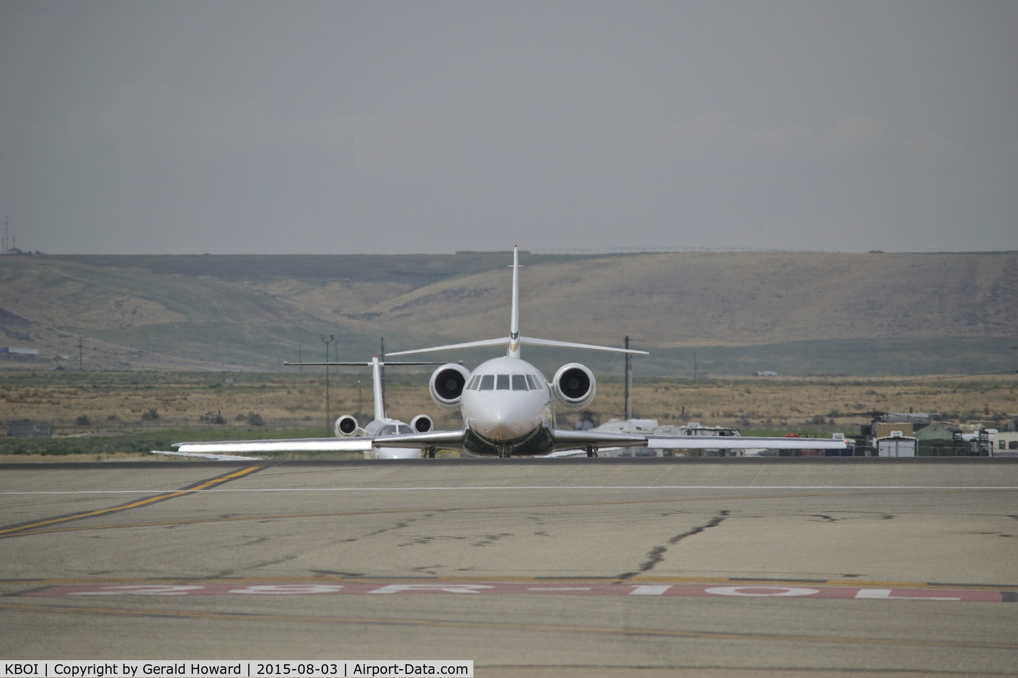 Boise Air Terminal/gowen Fld Airport (BOI) - Aircraft crossing from RWY 28L on Mike to RWY 28R.