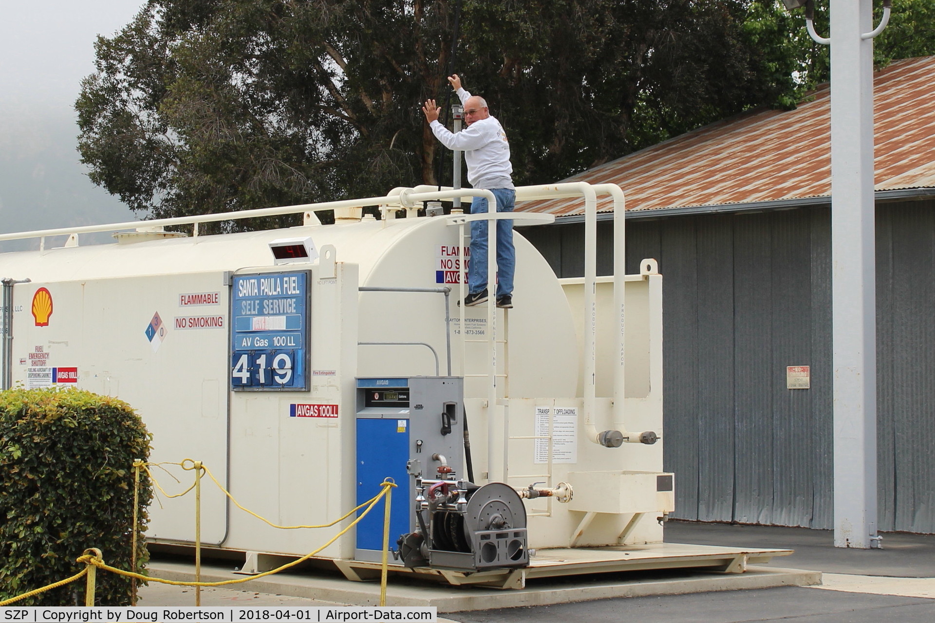 Santa Paula Airport (SZP) - Pete on the Santa Paula SHELL 100LL Fuel Tank. He drains the sump daily for any condensation H2O.