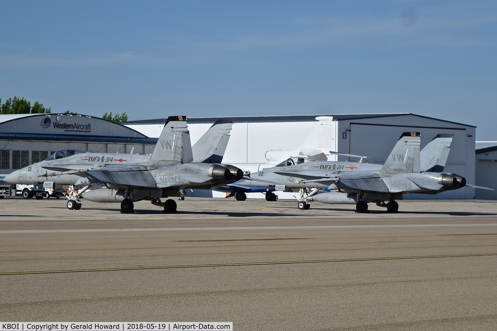 Boise Air Terminal/gowen Fld Airport (BOI) - Two F/A-18s from VMFA-314 “Black Knights”, NAS Miramar, CA parked on the sough GA ramp.
