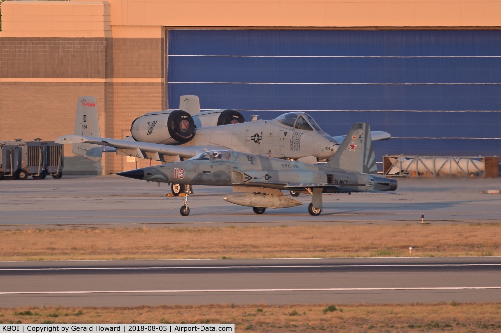 Boise Air Terminal/gowen Fld Airport (BOI) - Navy F-5N taxiing on Bravo in front of A-10C of the Idaho ANG.