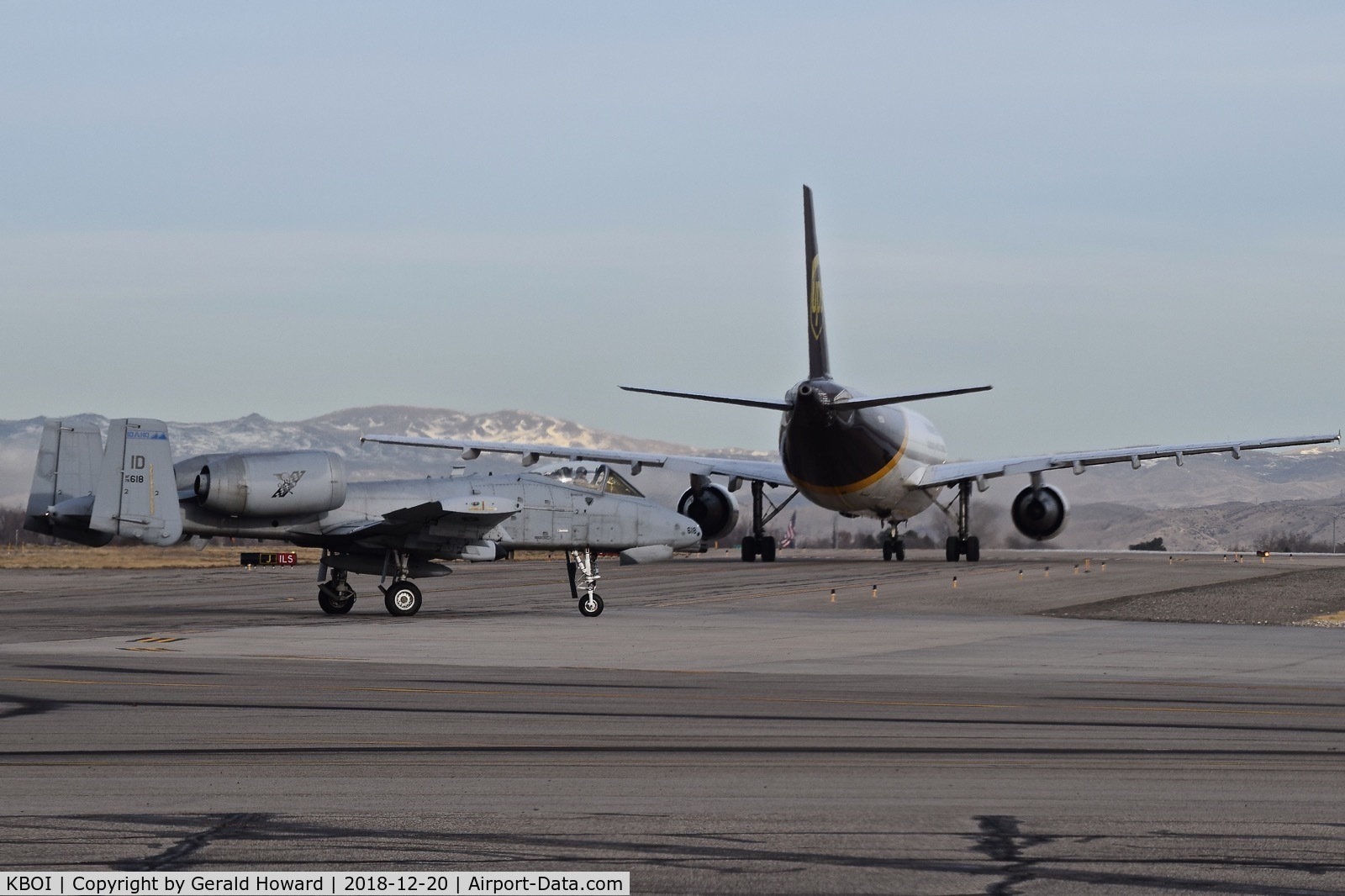 Boise Air Terminal/gowen Fld Airport (BOI) - Idaho ANG A-10C turning behind a UPS 767 waiting for runway clearance.