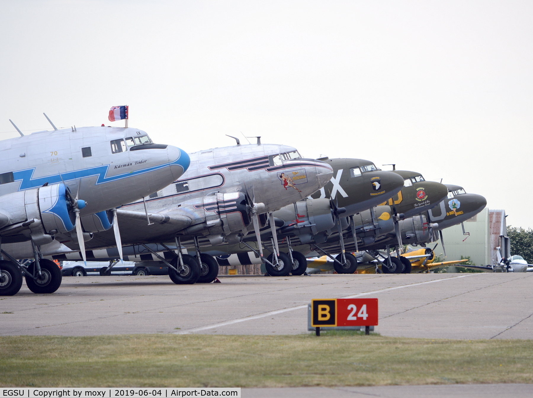 Duxford Airport, Cambridge, England United Kingdom (EGSU) - DC3s and an Li-2 lined up at Duxford before flying off to Caen, France on the 5th of June. 
