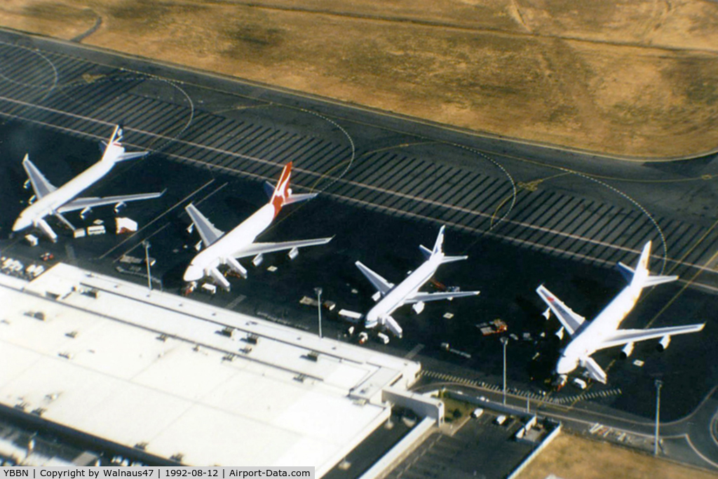 Brisbane International Airport, Brisbane, Queensland Australia (YBBN) - APOV of 'Old Eagle Farm' International Airport YBBN on 12Aug1992. The line-up on the ramp (from front right to left) is a JAL Super Resort Express B747-246B, an Air New Zealand B767, a Qantas B747-338, and a British Airways B747-436.
