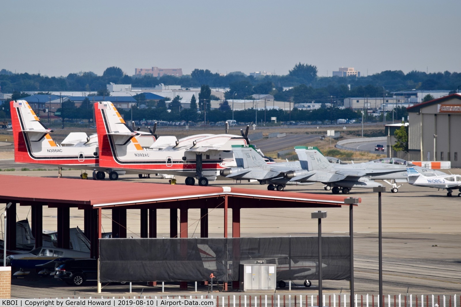 Boise Air Terminal/gowen Fld Airport (BOI) - Two water bombers and two F/A-18Cs parked on the north GA ramp.