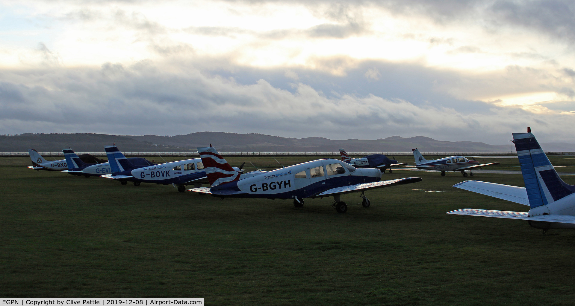 Dundee Airport, Dundee, Scotland United Kingdom (EGPN) - Sunset line-up of Tayside Aviation trainers