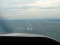 Frederick Municipal Airport (FDK) - On Final RWY 23 at FDK.  Count the planes on the airport.  1 on the Rwy and 4 on the taxi ways.  Taxiing in I noticed that the plane behind us had to leave the pattern for aircraft entering the runway.  This is a slow day at Maryland's 2nd busiest airport - by Sam Andrews