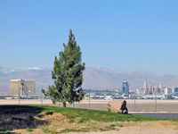 Mc Carran International Airport (LAS) - Looking towards McCarran, The Strip and Spring Mountains beyond from 'Park 2000' east of the runway. - by Brad Campbell