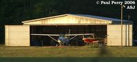 Tri-county Airport (ASJ) - Personal hangar at Tri-County, here at the end of a flying day - by Paul Perry