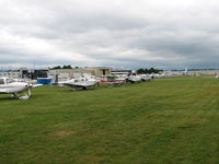 Frederick Municipal Airport (FDK) - Another view of the transcient flight line on AOPA Fly-in day.  The guys and gals in the red vests were giving out some dandy service directing traffic - by Sam Andrews