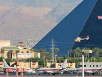 Mc Carran International Airport (LAS) - One of the many 'Tour' Helicopter flying past the Luxor and the Janet Ramp. - by Brad Campbell