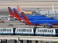 Mc Carran International Airport (LAS) - The 'C' Gates where Southwest Airlines docks. One of the Trams in foreground headed to 'D' Gates - by Brad Campbell