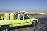 Byron Airport (C83) - Airport truck and visiting plane - by Bill Larkins