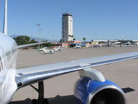 Tucson International Airport (TUS) - Tower and GA terminal from door of 757 - by John J. Boling