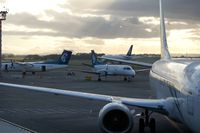 Auckland International Airport, Auckland New Zealand (AKL) - A busy morning in Auckland: Air NZ's DHC 8-300 (ZK-NEN), Saab 340 (ZK-NLG), B 737-300 (ZM-NGM), and in the background B 767-300 (ZK-NCJ) is taxiing to the runway - by Micha Lueck