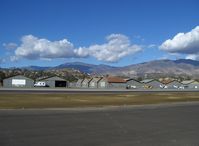 Santa Paula Airport (SZP) - Old Hangars, Topa Topa Mountains, Santa Paula Ridge, Santa Paula Peak in background. Elevations:  Topa Topa Mts. 6,244 ft & 6,704 ft. Ridge 2,817 ft. Peak 4,917 ft. - by Doug Robertson