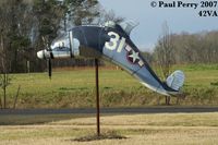 Virginia Beach Airport (42VA) - Decorative dolphin dressed as the Fighter Factory's FG-1D - by Paul Perry