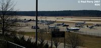 Raleigh-durham International Airport (RDU) - The GA apron near Runway 5L - by Paul Perry