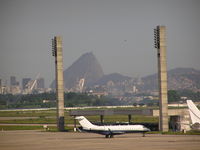 Galeão Airport, Antônio Carlos Jobim International Airport Brazil (SBGL) - Biz jet on ramp at Rio. Sugar Loaf Mountian in background. - by John J. Boling