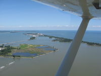 Griffing Sandusky Airport (SKY) - In the pattern on downwind for runway 9, looking north at Cedar Point amusement park. - by Bob Simmermon