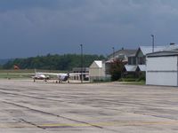 Rutland - Southern Vermont Regional Airport (RUT) - Taken on the tie down area. This is the Backside of the terminal. In the distance you can see the Civil Air Patrol hangars. - by Frank Wulff III