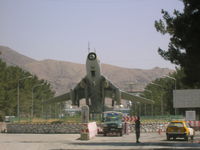Kabul International Airport - MIG on display outside terminal at Kabul, Afghanistan - by John J. Boling