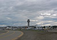 Ted Stevens Anchorage International Airport (ANC) - Control Tower and main terminal from General Avation parking area - by Timothy Aanerud