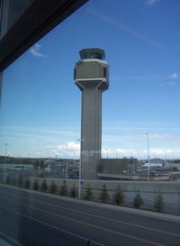 Ted Stevens Anchorage International Airport (ANC) - Air Traffic Control Tower seen from South Terminal C Concourse - by Doug Robertson