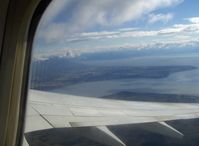 Ted Stevens Anchorage International Airport (ANC) - Airport adjacent Cook Inlet, Point Woronzof of Knik Arm. Taken from Alaska Airlines B737-700 climbing turn to altitude - by Doug Robertson