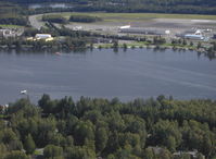 Lake Hood Seaplane Base (LHD) - Lake Hood SPB, Anchorage Int'l Airport ANC in background-taken from DHC-2 Beaver float plane N4444Z enroute to LHD - by Doug Robertson