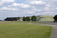 RAF Scampton Airport, Scampton, England United Kingdom (EGXP) - Flightline at RAF Scampton with Red Arrow Hawk - by Joop de Groot