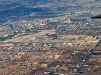 Mc Carran International Airport (LAS) - A view of McCarran while heading east. KVGT, also known as North Las Vegas Air Terminal can be seen towards center top. - by Brad Campbell