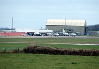 Newquay Cornwall International Airport / RAF St. Mawgan, Newquay, England United Kingdom (EGDG) - Two Skybus Twin Otters on the apron waiting to start the days work - by Terry Fletcher