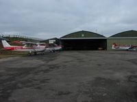 Bodmin Airfield Airport, Bodmin, England United Kingdom (EGLA) - Apron outside the main hangar - by Terry Fletcher