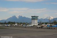 Langley Regional Airport - The control tower with the beautiful BC mountains in the background - by Michel Teiten ( www.mablehome.com )