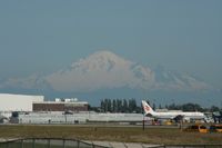 Vancouver International Airport, Vancouver, British Columbia Canada (YVR) - Mount Baker, in the Washington State can be seen over YVR (and seems closer than it actually is) with a 767 from Air China on the right - by Michel Teiten ( www.mablehome.com )