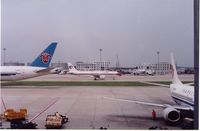 Beijing Capital International Airport, Beijing China (PEK) - China Eastern A320 taxiing past China Southern B777 and Air China B737,Beijing,Aug.2005 - by metricbolt