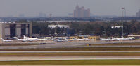 Orlando International Airport (MCO) - A view across to the Galaxy Aviation ramp at Orlando International - by Terry Fletcher