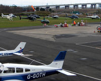 City Airport Manchester, Manchester, England United Kingdom (EGCB) - Despite the waterlogged airfield being closed to fixed wing traffic , 8 Helicopter vistors to Barton Airfield for the Manchester United v Arsenal Soccer match - by Terry Fletcher