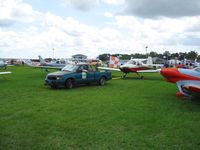 Lakeland Linder Regional Airport (LAL) - Towing planes through some tight fits at Sun N Fun 2008 - by Bob Simmermon