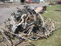 Crystal Airport (MIC) - The remains of a taildragger after the hangar fire on 27 April 2008 - by Timothy Aanerud