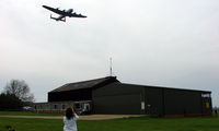 Peterborough/Sibson Airport - Lancaster Bomber does a low flypast at Peterborough Sibson after displaying at the nearby East of England Showground - by Terry Fletcher