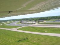Clark Regional Airport (JVY) - Departing 32 and looking south at downtown Louisville on the horizon. - by Bob Simmermon