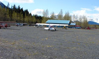 Girdwood Airport (AQY) - Looking on the North parking apron and Alpine Air helicopter facility - by Terry Fletcher