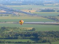 Toledo  Executive Airport (TDZ) - Approaching Metcalf from the south with a hot air ballon below. - by Bob Simmermon