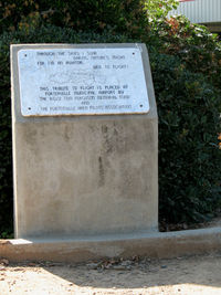 Porterville Municipal Airport (PTV) - Memorial at base of pole-mounted A-4 BuAer 147727 AH/400 USS Oriskany - by Steve Nation